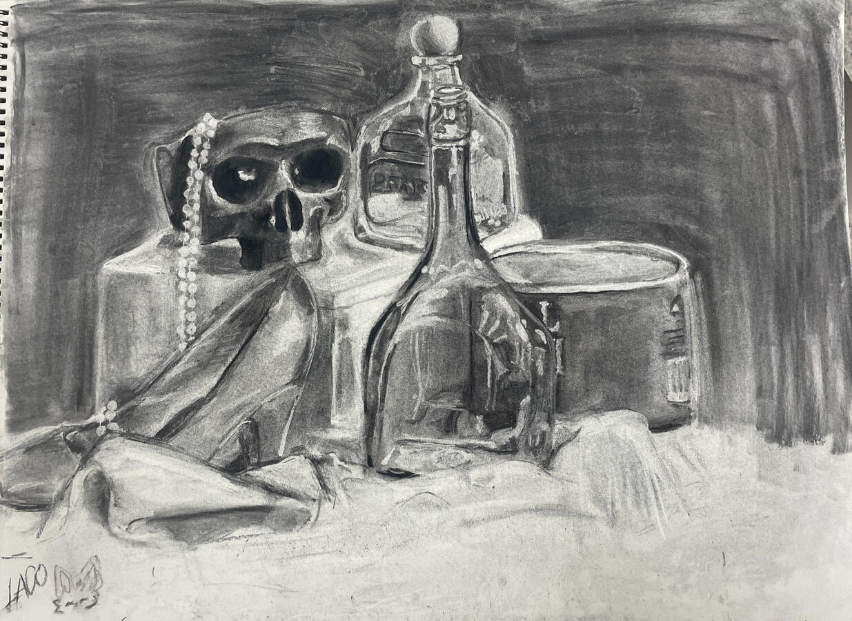 Charcoal drawing of a still life composition featuring a skull draped with a strand of pearls, flanked by two glass bottles and a tin, all resting on draped fabric.