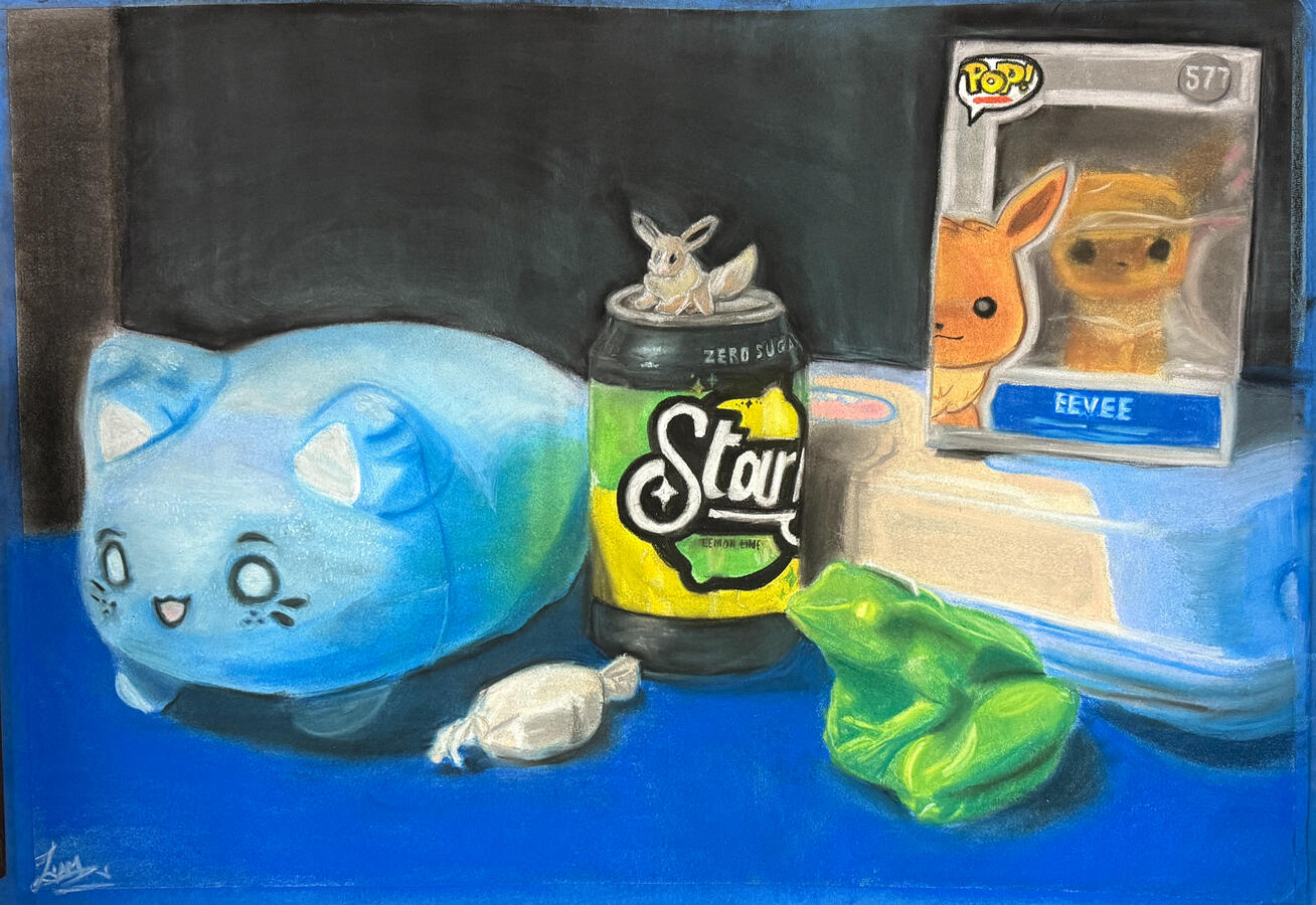 Pastel drawing depicting a still life arrangement of objects on a blue surface, including a blue cartoon cat pillow, a Starry Zero Sugar Lemon Lime soda can with a small eevee figurine on top, a green frog figurine, and a wrapped candy.