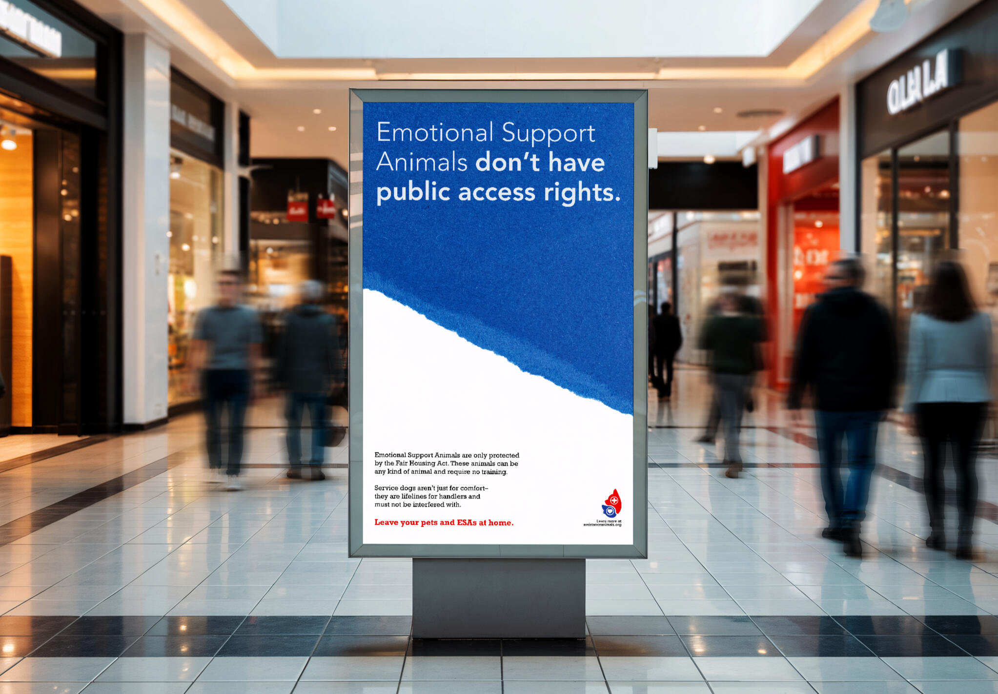 Poster Mockup in Shopping Mall A sign in a shopping mall with the text "Emotional Support Animals don't have public access rights," with an explanation that these animals are only protected by the Fair Housing Act, followed by the message to "Leave your pets at home."